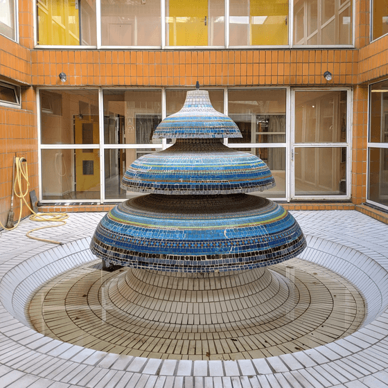 Unusual grade school courtyard fountain, Paris, France.